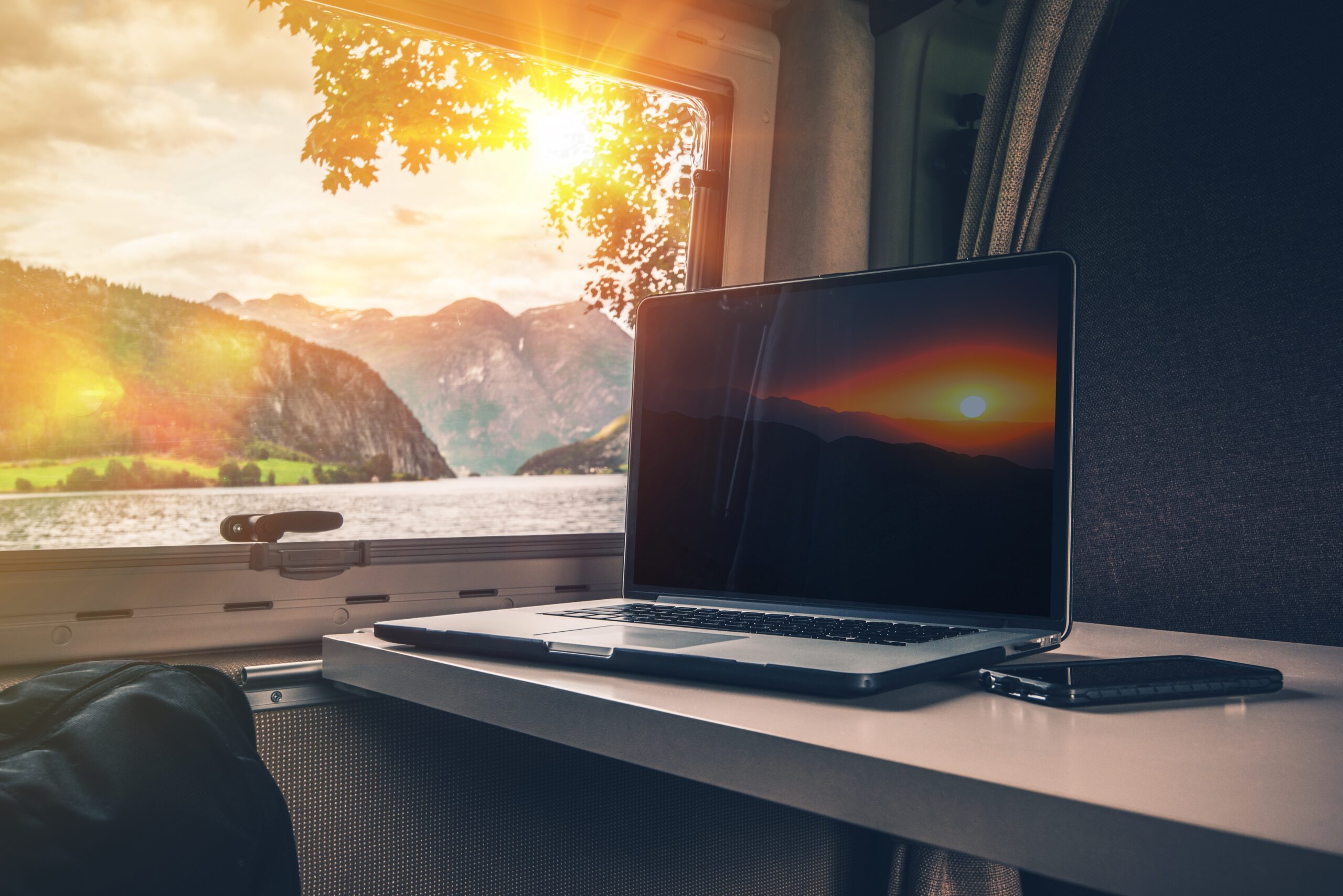 RV table with laptop and mountain view
